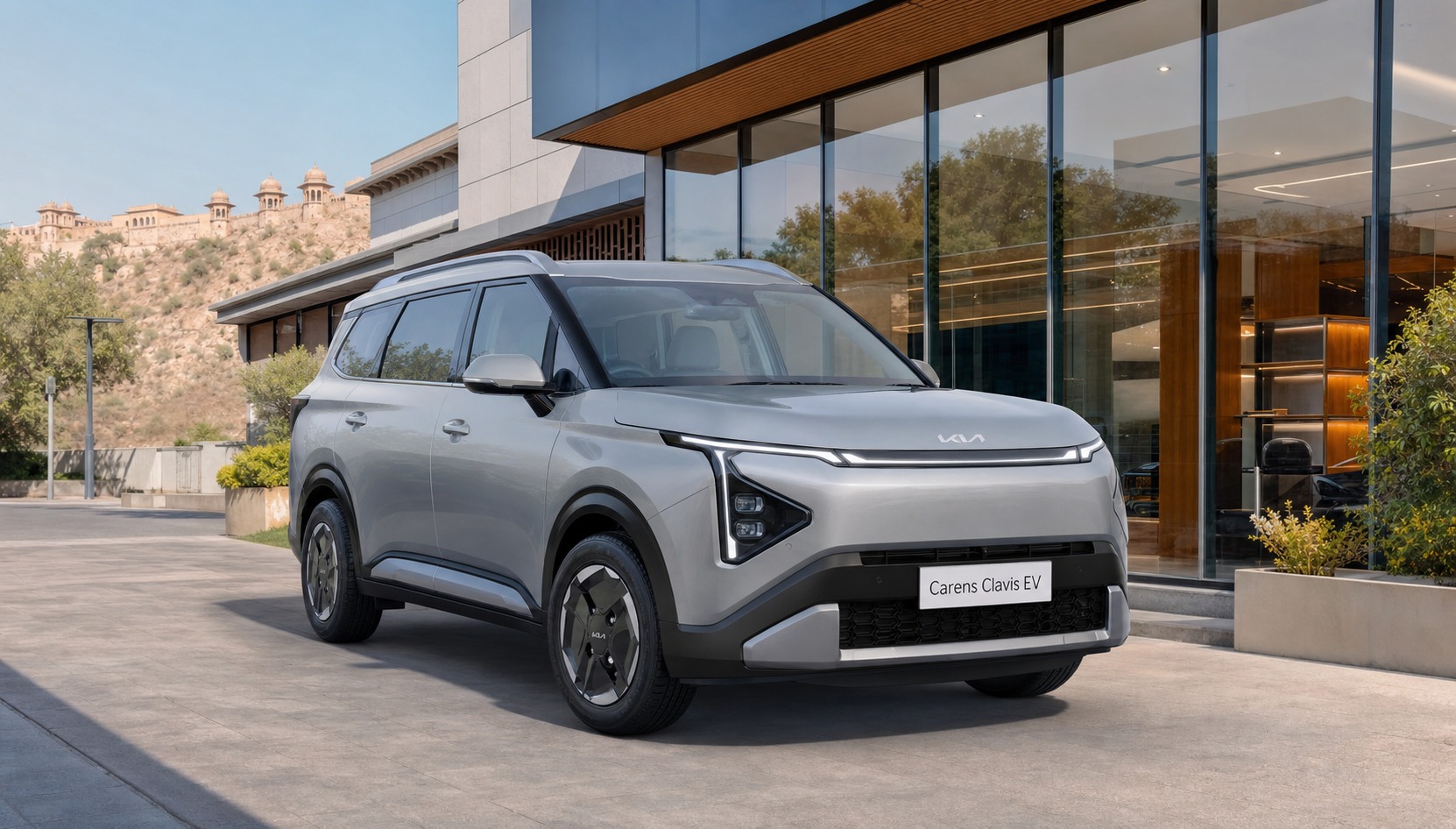 best Carens Clavis EV variant Jaipur hero image showing the electric family vehicle outside a Jaipur dealership for trim comparison.